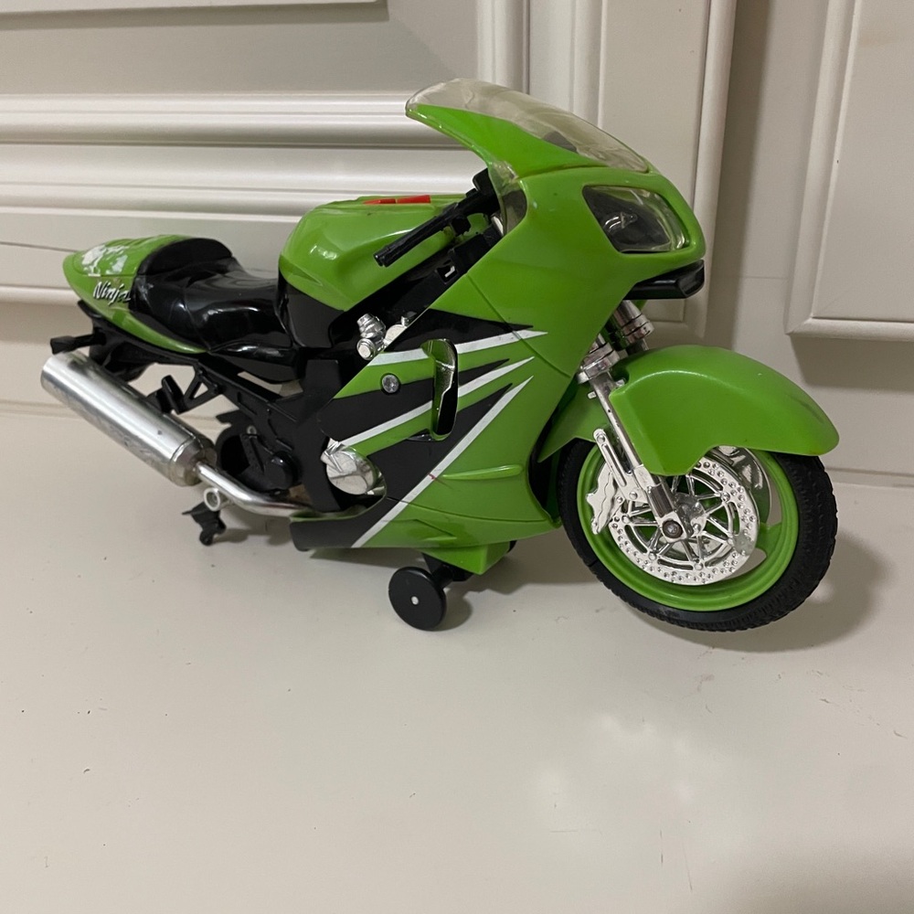 Ninja Green Kids Motorcycle Toy - wheel is missing side is broken